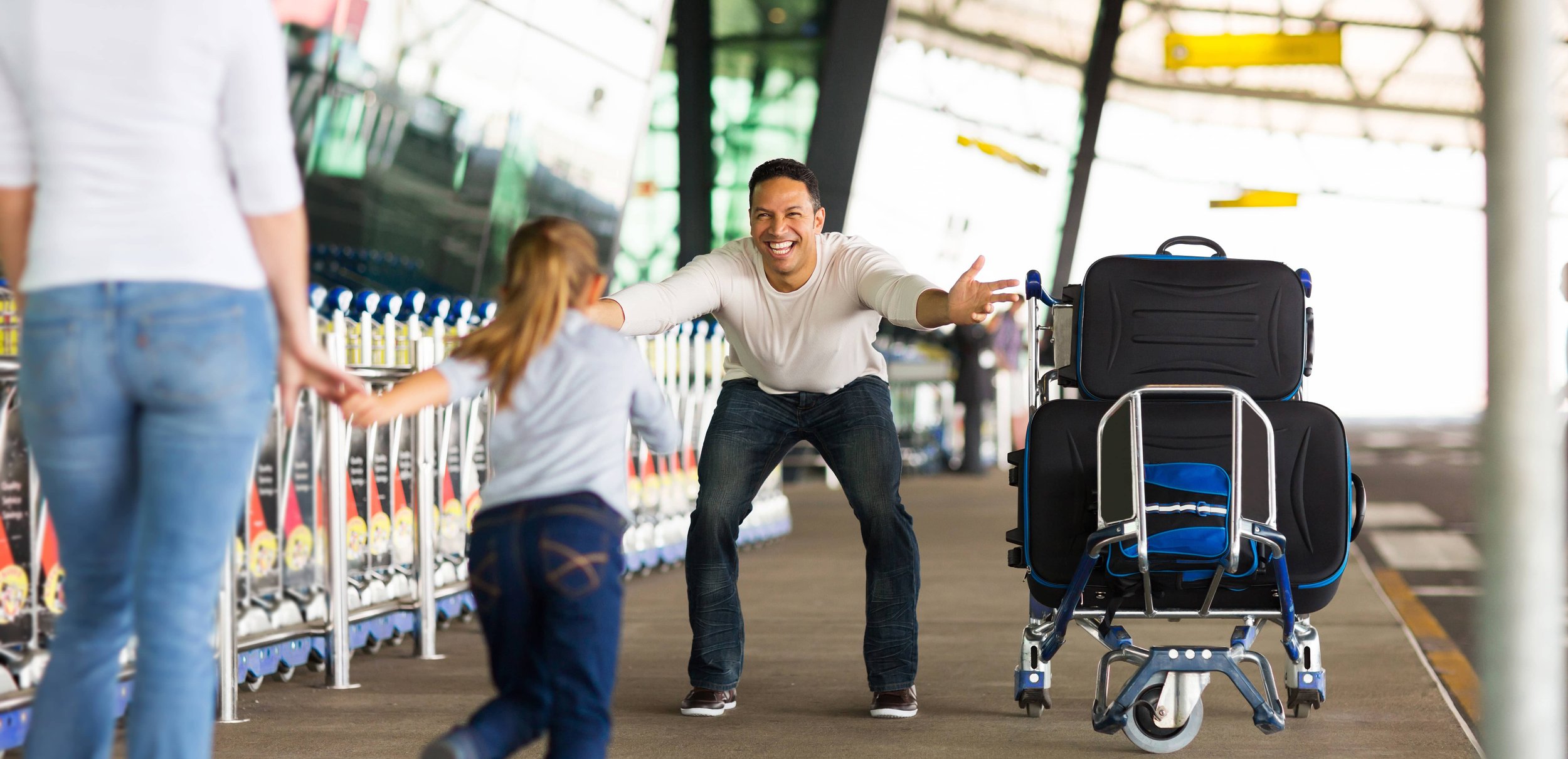 People walking with luggage at airport